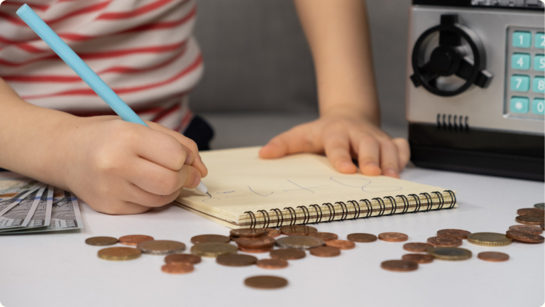A child pretending to work out nursery funding by counting pennys