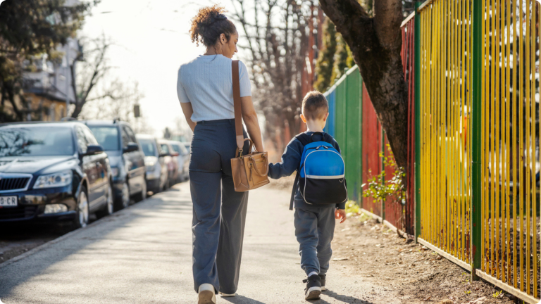 Mum walking her child home after she did her research to apply for primary school