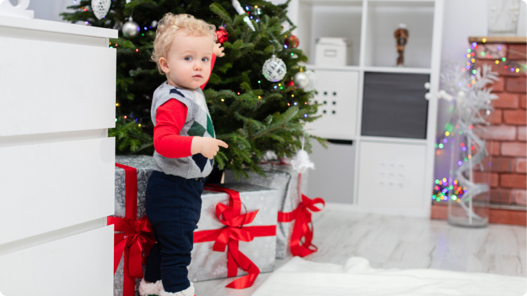 A child in front of a christmas tree