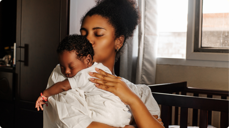 Separation anxiety in infants is a normal part of development. Learn the early signs, why it happens, and how to support your baby with confidence. - shown by a mum having to hold her baby to stop them from crying