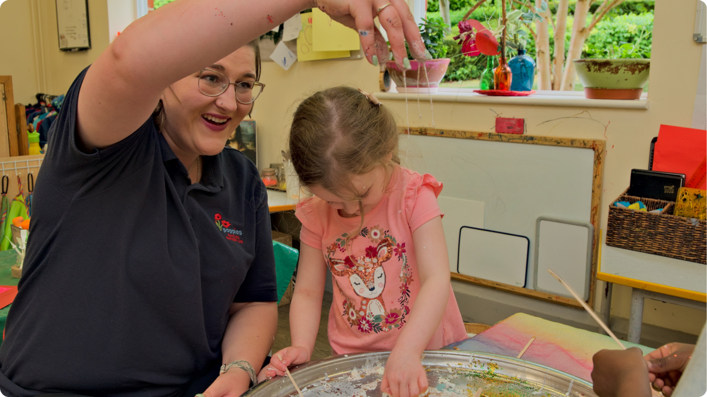 How to Build Confidence in a Sensitive Child shown by a Poppies Nursery Practitioner laughing with a child